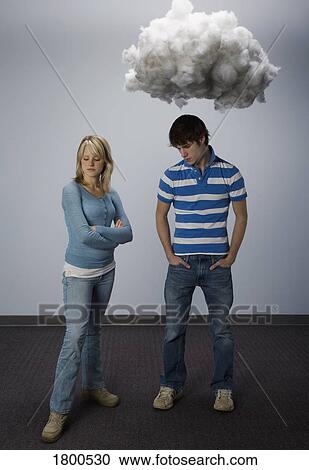 Male and female standing apart fighting View Large Photo Image Stock Image - Male and female standing apart fighting. Fotosearch