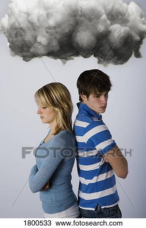 Male and female under dark cloud View Large Photo Image Stock Image - Male and female under dark cloud. Fotosearch
