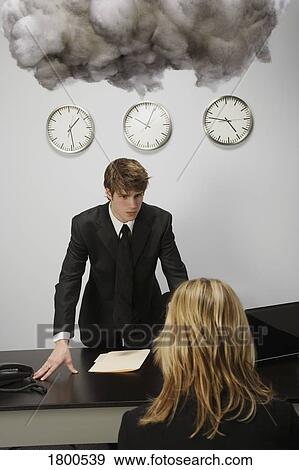 Man and woman in office under cloud View Large Photo Image Stock Photo - Man and woman in office under cloud. Fotosearch