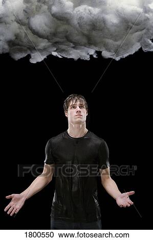 Stock Image - Man Waiting For Rain Under Rain cloud. Fotosearch
