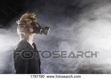 Stock Image - Man wearing a gas mask. Fotosearch