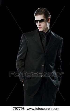 Man wearing a suit and sunglasses View Large Photo Image Stock Photo - Man wearing a suit and sunglasses. Fotosearch