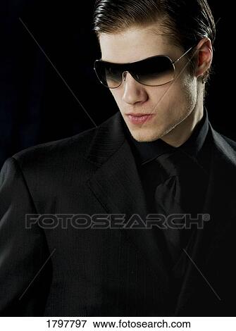 Man wearing sunglasses View Large Photo Image Stock Photo - Man wearing sunglasses. Fotosearch