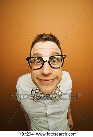 Man wearing taped glasses and a bow tie View Large Photo Image Picture - Man wearing taped glasses and a bow tie. Fotosearch
