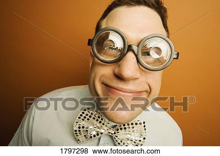 Stock Photo - Man wearing thick glasses and a bow tie. Fotosearch