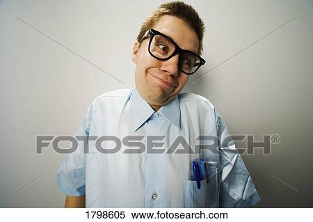 Stock Photography - Man wearing thick glasses and pens in his pocket. Fotosearch