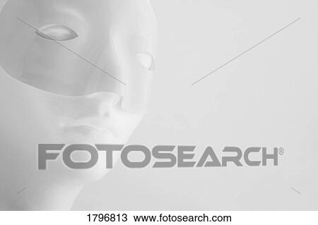 Stock Image - Mannequin wearing a mask. Fotosearch
