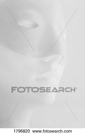 Stock Image - Mannequin wearing a mask. Fotosearch