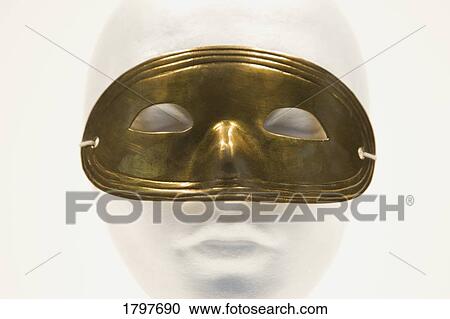 Stock Image - Mannequin wearing a mask. Fotosearch