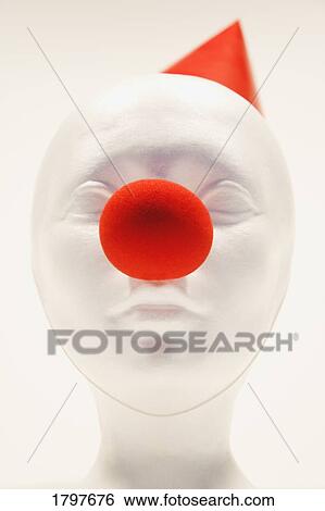 Stock Photograph - Mannequin wearing a party hat and clown nose. Fotosearch