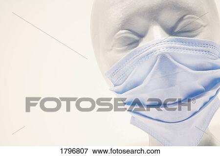 Stock Photo - Mannequin wearing surgical mask. Fotosearch