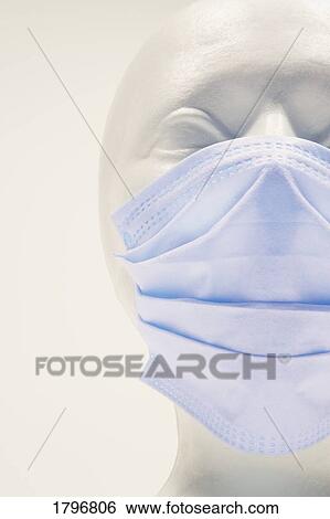 Stock Photograph - Mannequin wearing surgical mask. Fotosearch