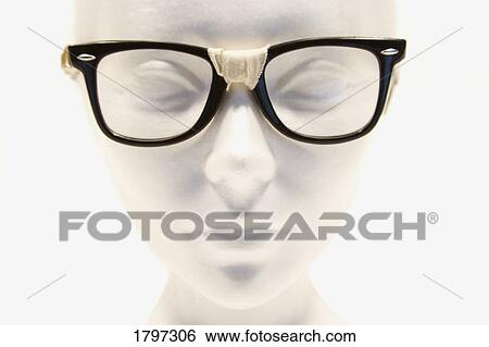 Mannequin wearing taped glasses View Large Photo Image Stock Photograph - Mannequin wearing taped glasses. Fotosearch