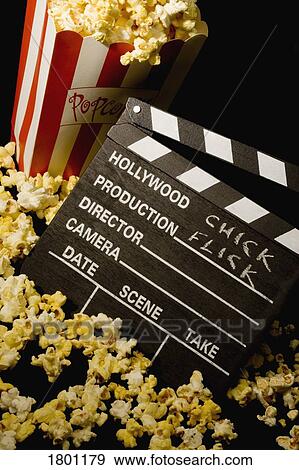 Movie clapboard and popcorn View Large Photo Image Stock Photo - Movie clapboard and popcorn. Fotosearch
