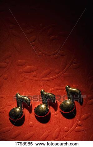 Musical notes on the red background View Large Photo Image Stock Photography - Musical notes on the red background. Fotosearch
