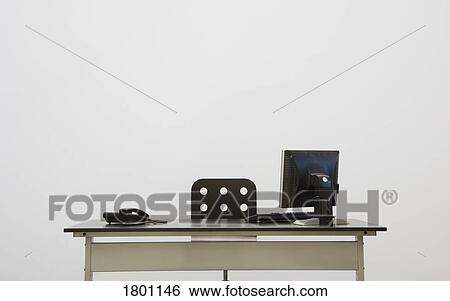 Stock Photograph - Office desk with computer and phone. Fotosearch