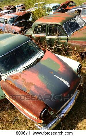 Stock Image - Old rusted cars. Fotosearch