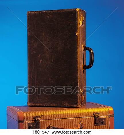 Stock Photo - Old suitcase on top of another . Fotosearch