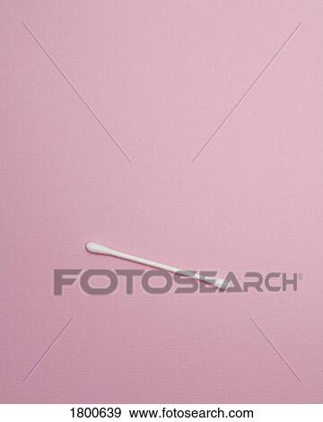 Stock Photo - One Cotton Swab On Pink Surface. Fotosearch
