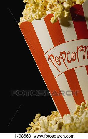 Stock Image - Overflowing popcorn. Fotosearch