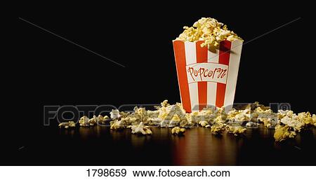 Overflowing popcorn View Large Photo Image Stock Photo - Overflowing popcorn. Fotosearch
