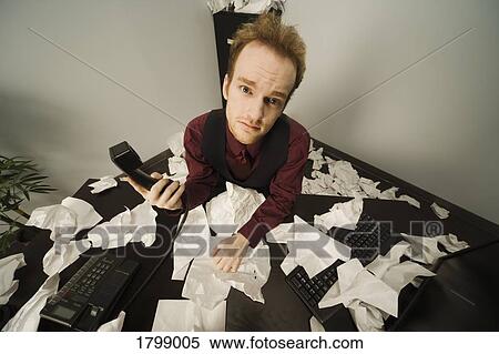 Stock Photography - Overwhelmed businessman. Fotosearch