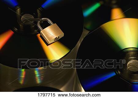Padlock on a stack of compact discs View Large Photo Image Stock Photography - Padlock on a stack of compact discs. Fotosearch