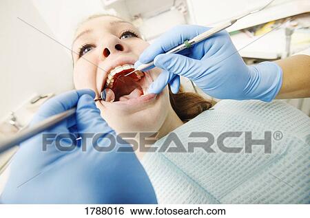 Stock Photograph - Patient at the dentist. Fotosearch