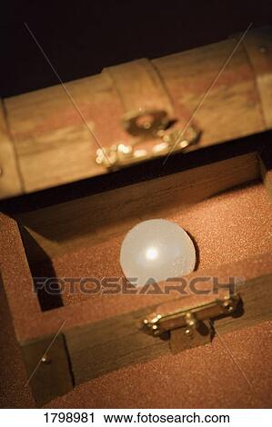 Pearl in a wooden box View Large Photo Image Stock Image - Pearl in a wooden box. Fotosearch