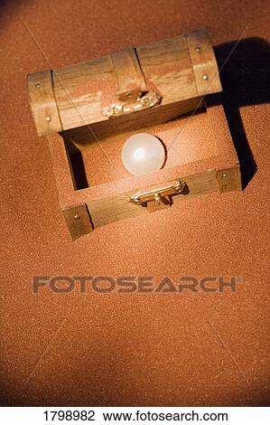 Pearl in a wooden box View Large Photo Image Stock Image - Pearl in a wooden box. Fotosearch
