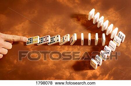 Stock Photo - Person knocking over dominoes. Fotosearch