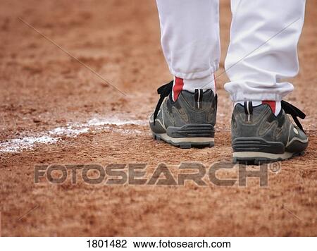 Person wearing baseball shoes View Large Photo Image Stock Image - Person wearing baseball shoes. Fotosearch