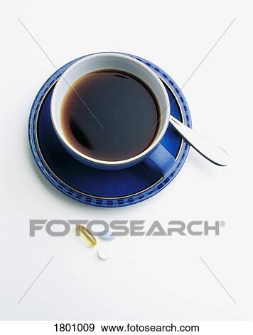 Pills beside a cup of coffee View Large Photo Image Stock Photo - Pills beside a cup of coffee. Fotosearch
