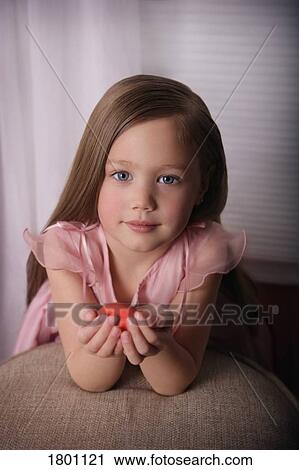 Portrait of a little girl holding Easter egg View Large Photo Image Stock Image - Portrait of a little girl holding Easter egg . Fotosearch