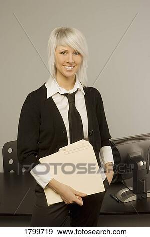 Stock Photo - Portrait of a woman at work. Fotosearch