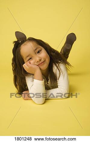 Stock Photo - Portrait of little girl relaxing. Fotosearch