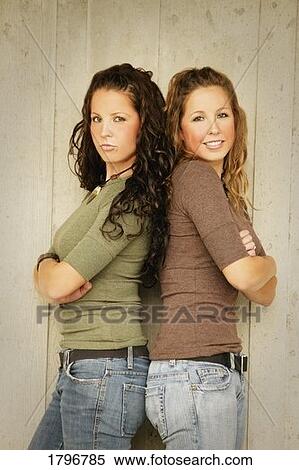 Portrait of twin sisters View Large Photo Image Stock Photography - Portrait of twin sisters. Fotosearch