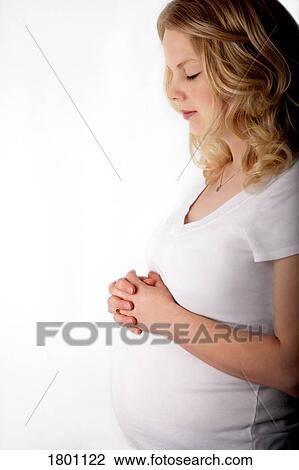 Pregnant mother praying View Large Photo Image Stock Image - Pregnant mother praying . Fotosearch