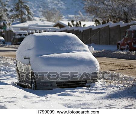Stock Photo - Snow-covered car. Fotosearch
