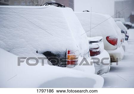 Stock Photograph - Snow covered vehicles. Fotosearch