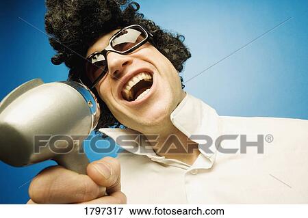 Stock Photo - Stepping up to the microphone. Fotosearch