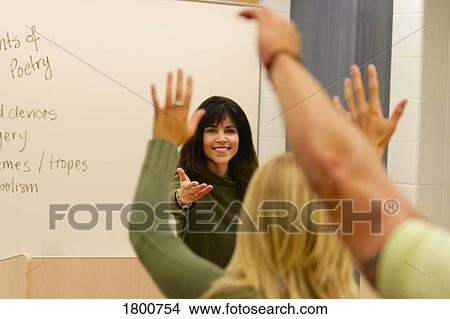 Teacher choosing students with hands raised View Large Photo Image Picture - Teacher choosing students with hands raised. Fotosearch
