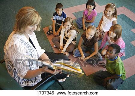 Stock Photograph - Teacher with students in a class. Fotosearch