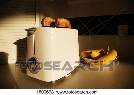 Toaster with toast and bananas View Large Photo Image Stock Photo - Toaster with toast and bananas. Fotosearch