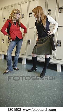 Two girls glaring at each other View Large Photo Image Stock Image - Two girls glaring at each other . Fotosearch
