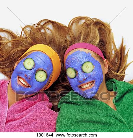 Picture - Two girls pampering themselves. Fotosearch