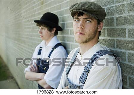 Two young men in old-fashioned garments View Large Photo Image Stock Photo - Two young men in old-fashioned garments. Fotosearch