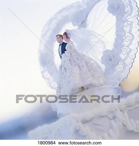 Wedding cake topper of a wedding couple View Large Photo Image Picture - Wedding cake topper of a wedding couple. Fotosearch