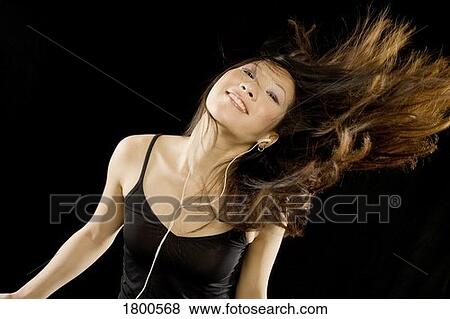 Stock Photo - Woman Dancing To Music. Fotosearch