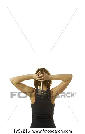 Stock Photography - Woman holding a dumbbell. Fotosearch